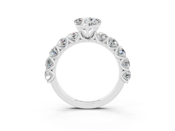 Platinum Heart Cut Moissanite Prong Setting with Side Stones on a Pave Band