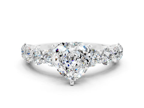 White gold Heart Cut Moissanite Prong Setting with Side Stones on a Pave Band