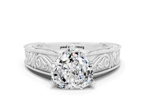 White gold Heart Cut Moissanite Solitaire Ring with Engraved Band and Four-Prong Setting