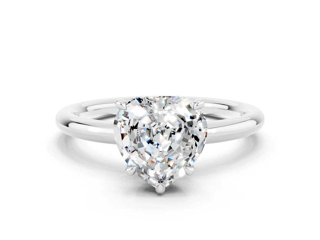 White gold Heart Cut Moissanite Solitaire Ring with Thin Band and Four-Prong Setting