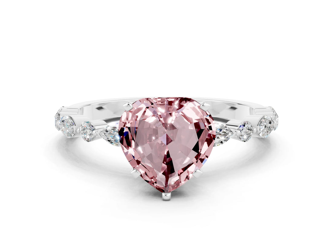 White gold Heart Cut Morganite Solitaire with Side Stones on a Pavé Band and Four-Prong Setting