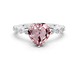 White gold Heart Cut Morganite Solitaire with Side Stones on a Pavé Band and Four-Prong Setting