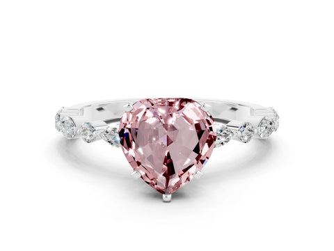 White gold Heart Cut Morganite Solitaire with Side Stones on a Pavé Band and Four-Prong Setting