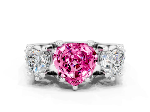 White gold Heart Cut Pink Sapphire Three-Stone Ring with Channel Set Band and Four-Prong Setting