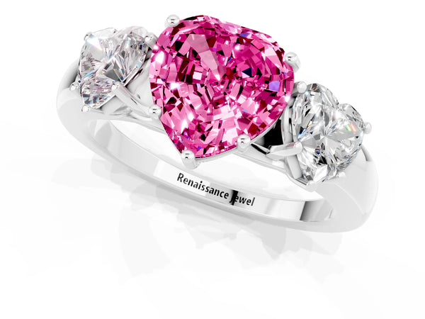 Platinum Heart Cut Pink Sapphire Three-Stone Ring with Four-Prong Setting and Classic Band