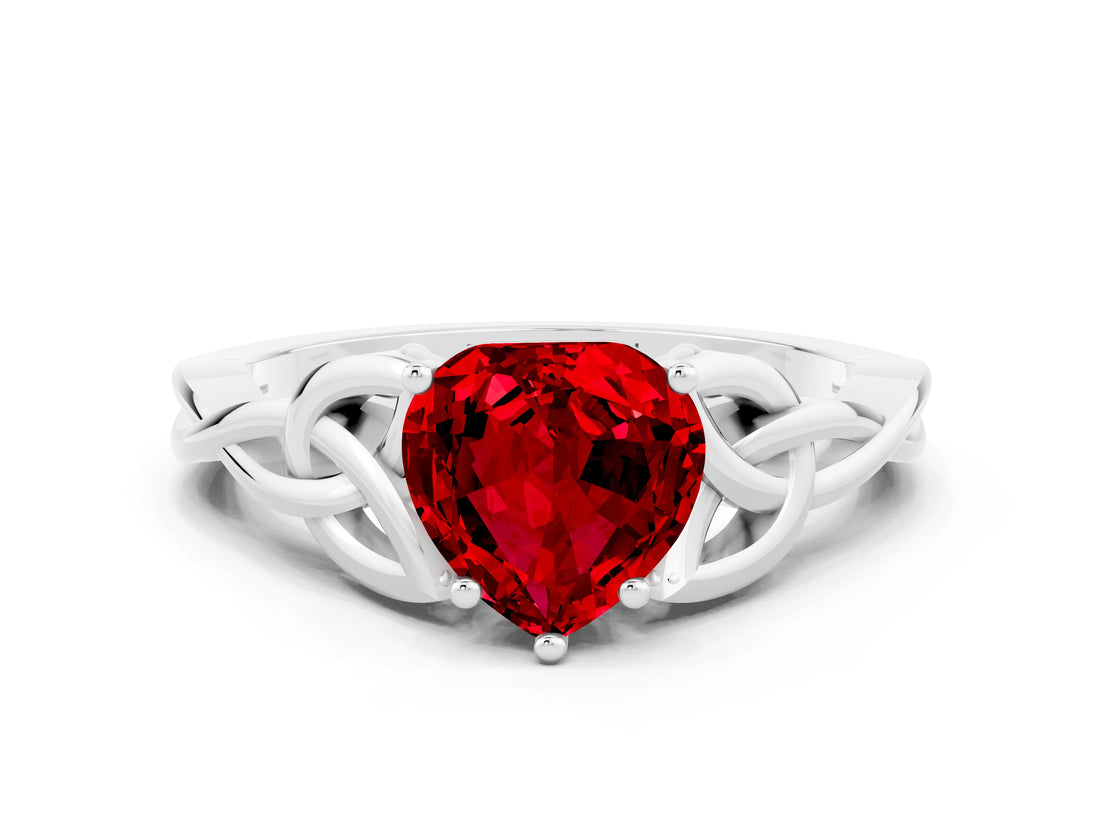 White gold Heart Cut Ruby Solitaire Engagement Ring with Celtic Knot Band and Four-Prong Setting
