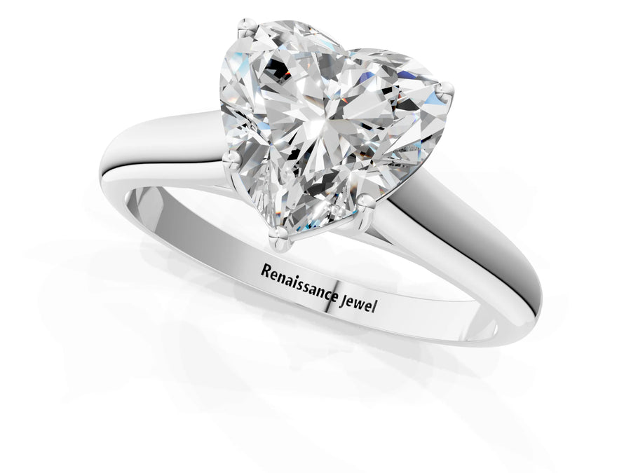 White gold Heart Cut Solitaire Engagement Ring with Tapered Band and Four-Prong Setting