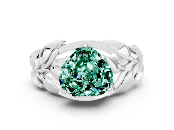 Platinum Heart Cut Green Sapphire Leaf-Inspired Engagement Ring with Round Accents and Prong Setting