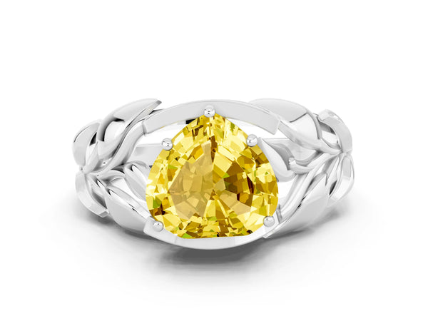 Platinum Heart Cut Yellow Sapphire Leaf-Inspired Engagement Ring with Round Accents and Prong Setting