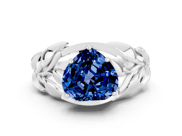 Silver Heart Cut Blue Sapphire Leaf-Inspired Engagement Ring with Round Accents and Prong Setting
