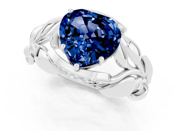 Silver Heart Cut Blue Sapphire Leaf-Inspired Engagement Ring with Round Accents and Prong Setting