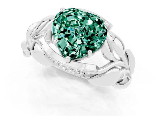 Platinum Heart Cut Green Sapphire Leaf-Inspired Engagement Ring with Round Accents and Prong Setting