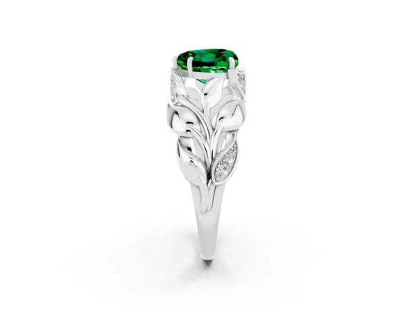 Silver Heart Cut Emerald Leaf-Inspired Engagement Ring with Round Accents and Prong Setting