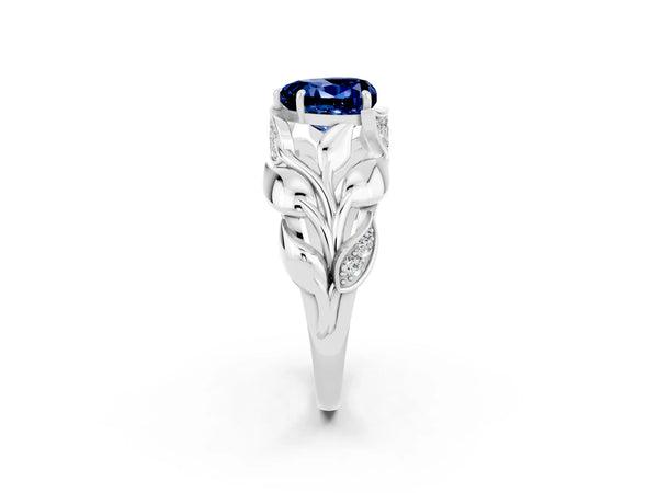 Silver Heart Cut Blue Sapphire Leaf-Inspired Engagement Ring with Round Accents and Prong Setting