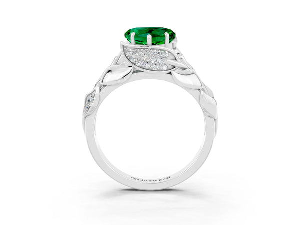 Platinum Heart Cut Emerald Leaf-Inspired Engagement Ring with Round Accents and Prong Setting