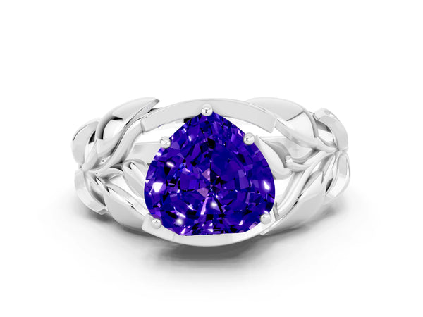 Platinum Heart Cut Tanzanite Leaf-Inspired Engagement Ring with Round Accents and Prong Setting