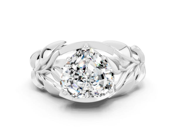 Platinum Heart Cut Moissanite Leaf-Inspired Engagement Ring with Round Accents and Prong Setting