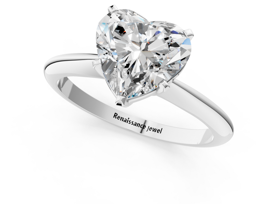 White gold Heart Cut Solitaire Ring with Four-Prong Setting on a Classic Band
