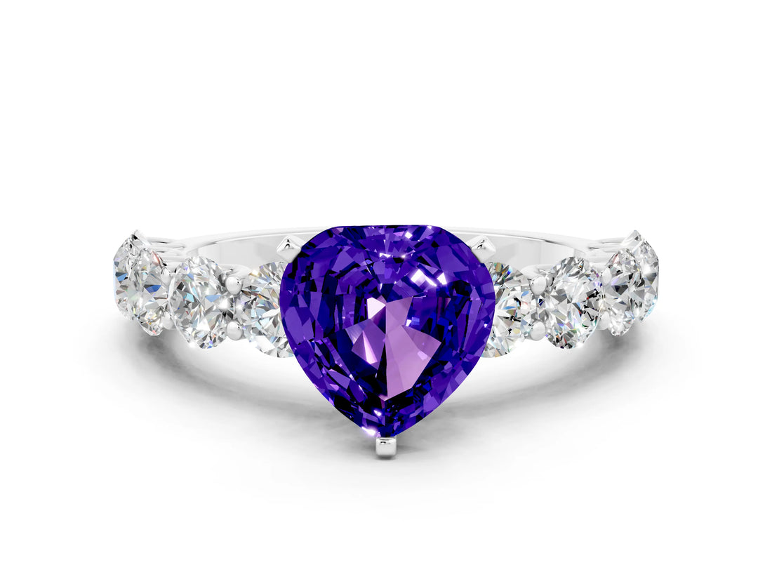 White gold Heart Cut Tanzanite Prong Setting with Side Stones on a Pave Band