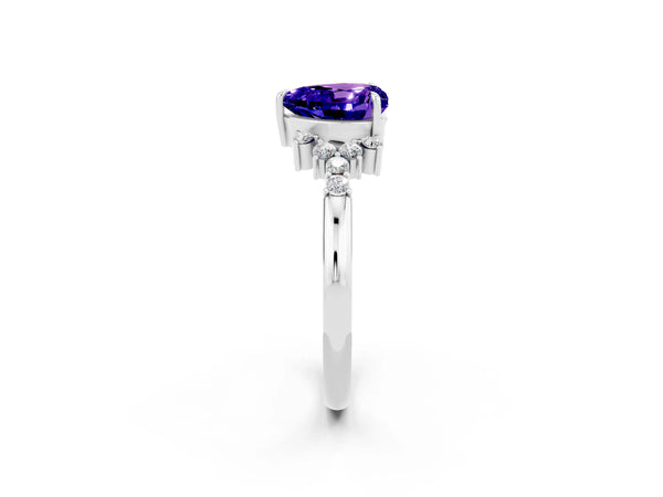 White gold Heart Cut Tanzanite Ring with Side Stones and Four-Prong Setting