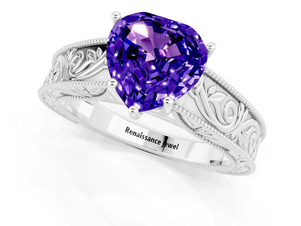 Platinum Heart Cut Tanzanite Solitaire Ring with Engraved Band and Four-Prong Setting
