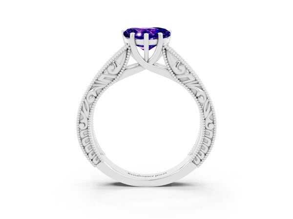 White gold Heart Cut Tanzanite Solitaire Ring with Engraved Band and Four-Prong Setting