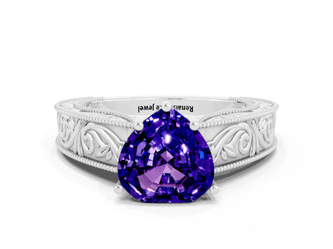 White gold Heart Cut Tanzanite Solitaire Ring with Engraved Band and Four-Prong Setting