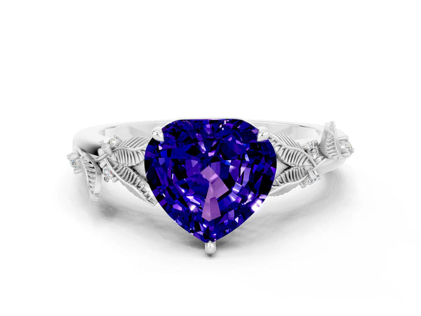 Platinum Heart Cut Tanzanite Solitaire Ring with Leaf Motif Band and Four-Prong Setting
