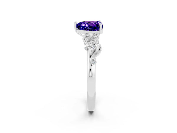 White gold Heart Cut Tanzanite Solitaire Ring with Leaf Motif Band and Four-Prong Setting