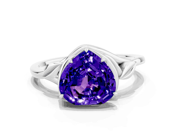 Platinum Heart Cut Tanzanite Solitaire Ring with Twist Band and Four-Prong Setting