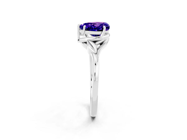 White gold Heart Cut Tanzanite Solitaire Ring with Twist Band and Four-Prong Setting