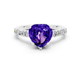 White gold Heart Cut Tanzanite Solitaire with Side Baguettes and Channel Set Band