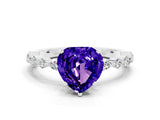 White gold Heart Cut Tanzanite Solitaire with Side Stones on a Pavé Band and Four-Prong Setting