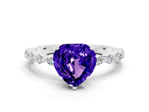 White gold Heart Cut Tanzanite Solitaire with Side Stones on a Pavé Band and Four-Prong Setting
