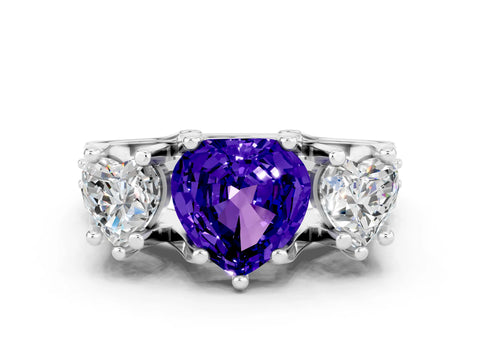 White gold Heart Cut Tanzanite Three-Stone Ring with Channel Set Band and Four-Prong Setting