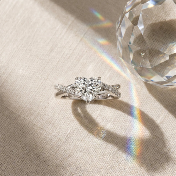 White gold Heart Cut Twist Band Solitaire Diamond Ring with Pavé Setting