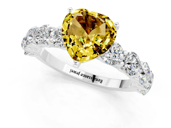 White gold Heart Cut Yellow Sapphire Prong Setting with Side Stones on a Pave Band