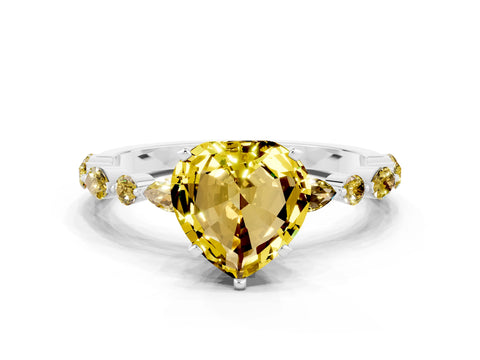 White gold Heart Cut Yellow Sapphire Solitaire with Side Stones on a Pavé Band and Four-Prong Setting