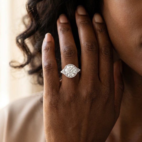White gold Hexagonal Halo Round Diamond Solitaire with Pavé Band and Four-Prong Setting