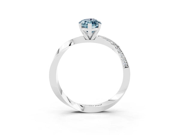 White gold Marquise Cut Aquamarine Engagement Ring with Side Stone Accents and Four-Prong Setting