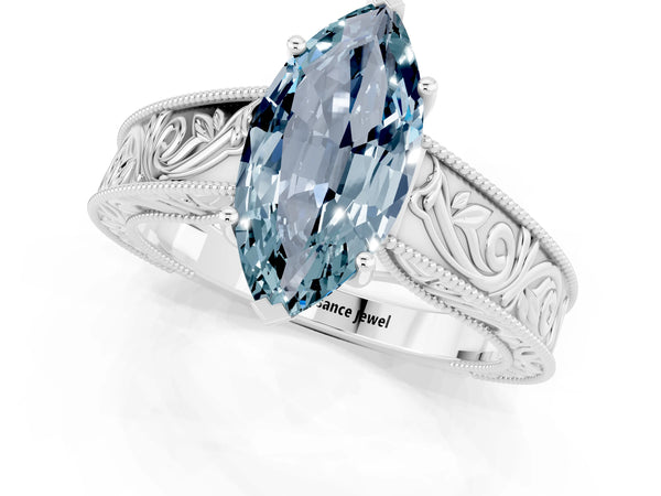 Silver Marquise Cut Aquamarine Solitaire Ring with Engraved Band and Four-Prong Setting