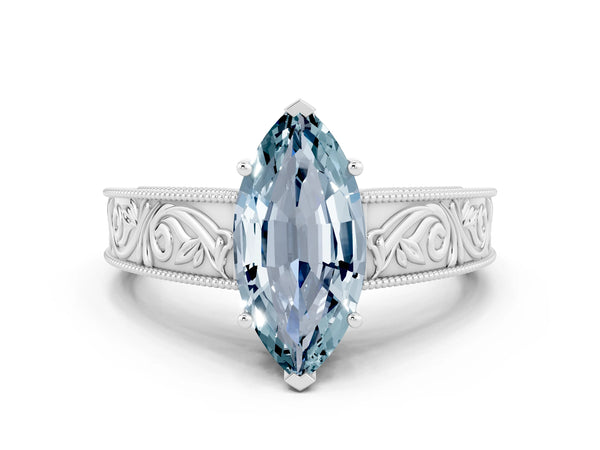 White gold Marquise Cut Aquamarine Solitaire Ring with Engraved Band and Four-Prong Setting