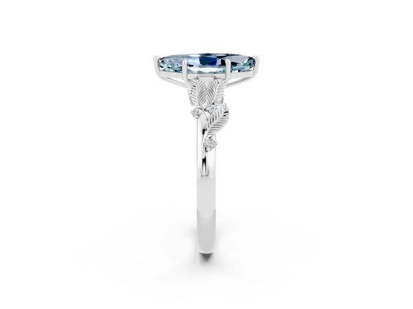 Silver Marquise Cut Aquamarine Solitaire Ring with Leaf Motif Band and Four-Prong Setting