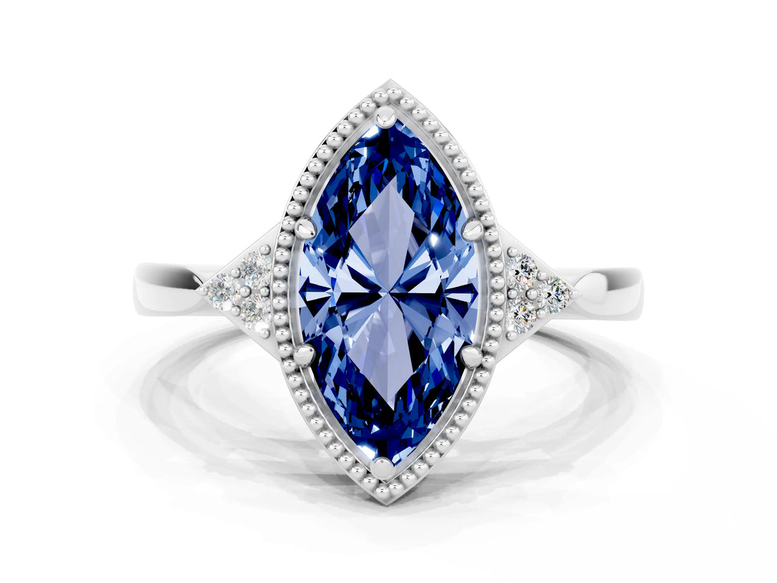 White gold Marquise Cut Blue Sapphire Halo Ring with Tapered Band and Four-Prong Setting