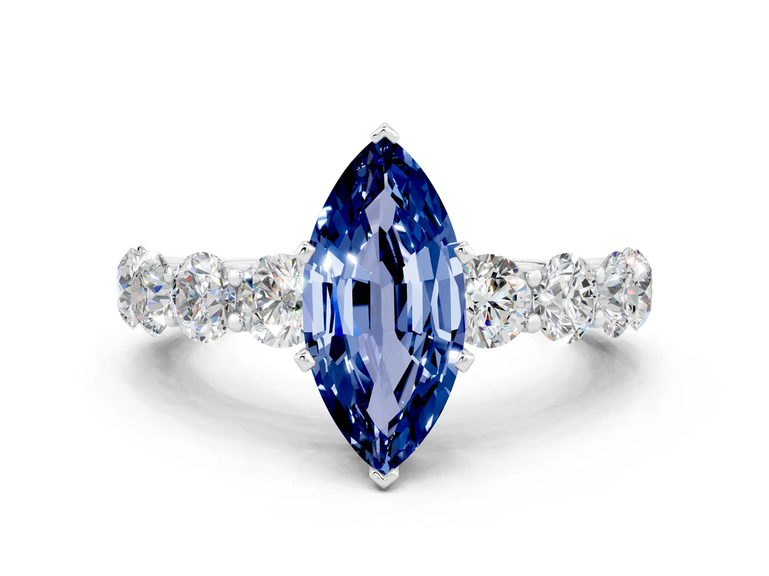 White gold Marquise Cut Blue Sapphire Prong Setting with Side Stones on a Pave Band