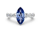 White gold Marquise Cut Blue Sapphire Prong Setting with Side Stones on a Pave Band