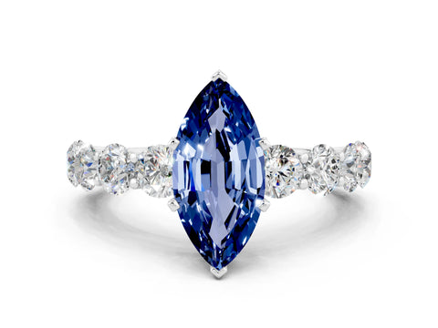 White gold Marquise Cut Blue Sapphire Prong Setting with Side Stones on a Pave Band