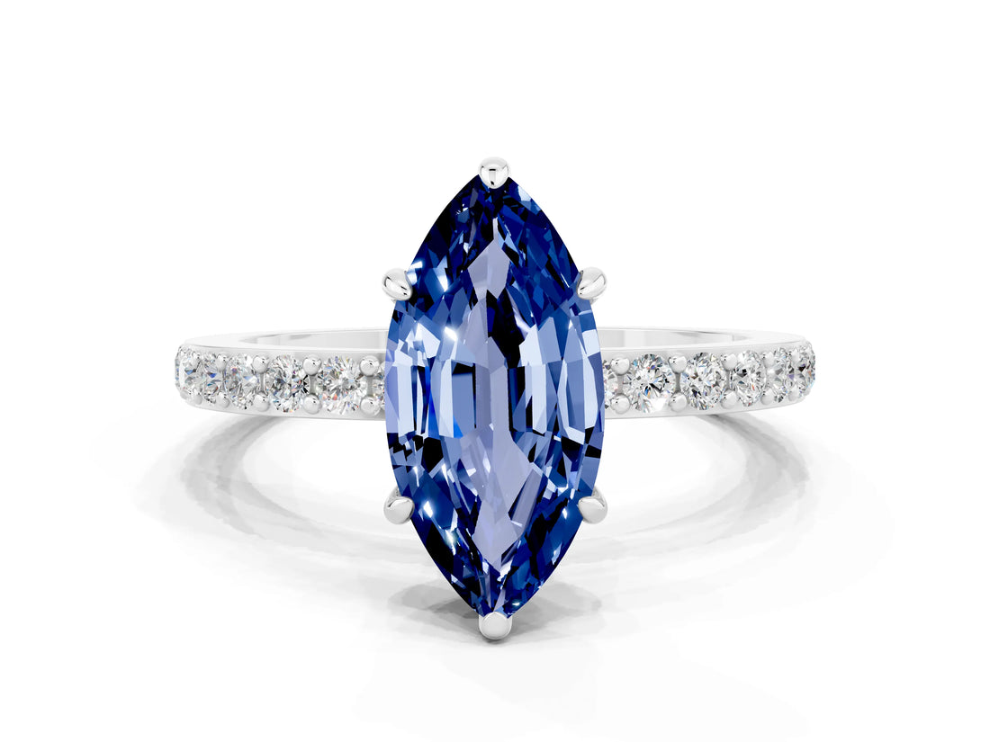 White gold Marquise Cut Blue Sapphire Solitaire Engagement Ring with Pavé Band and Four-Prong Setting