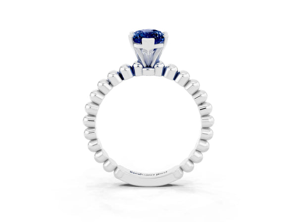 Platinum Marquise Cut Blue Sapphire Solitaire Ring with Beaded Band and Prong Setting