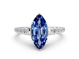 White gold Marquise Cut Blue Sapphire Solitaire Ring with Cathedral Setting and Pavé Band